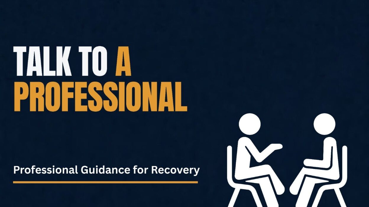 Two people seated in conversation illustrating talking to a professional for recovery